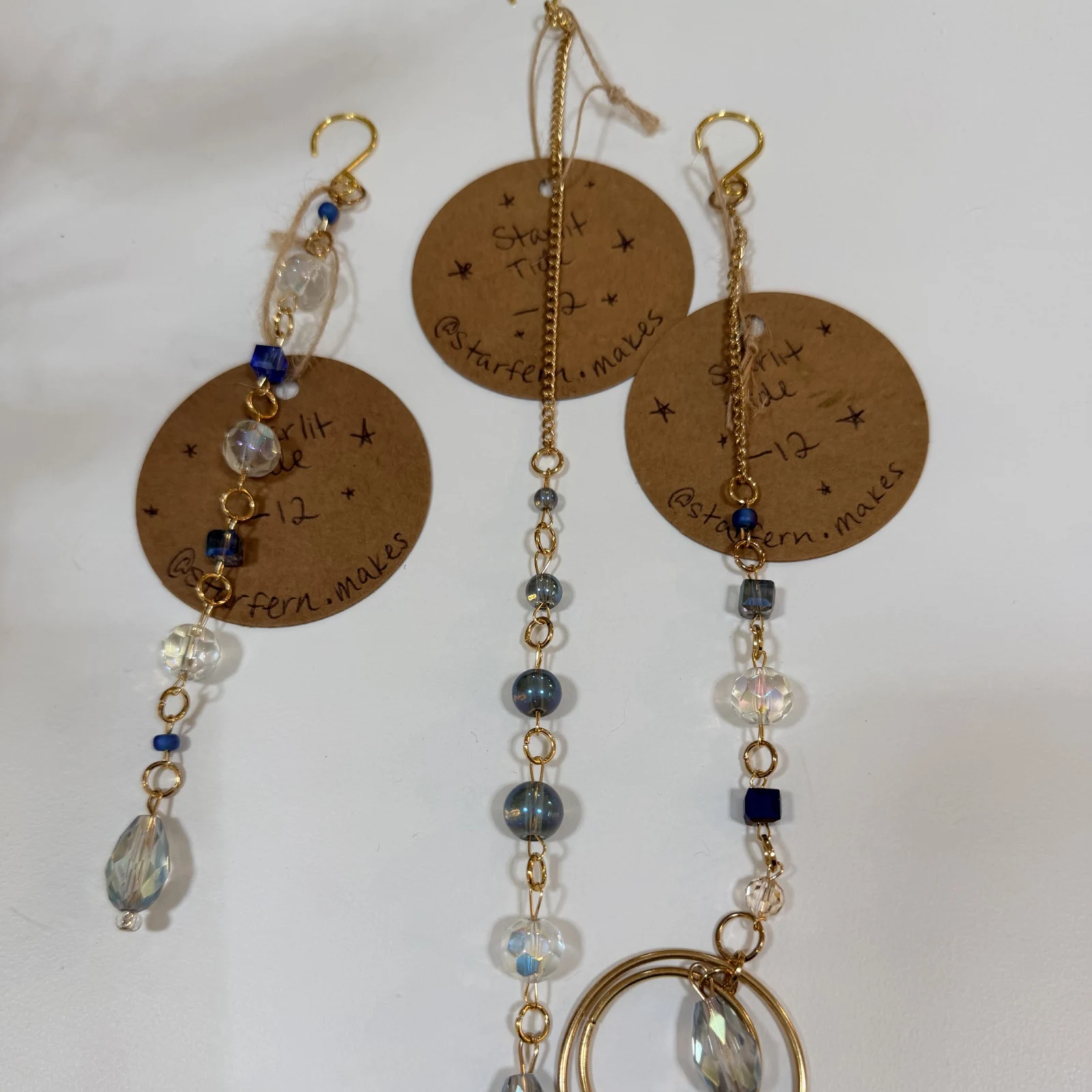 StarFern Plant Charms with decorative beaded keychain attachments displayed on crafting surface.