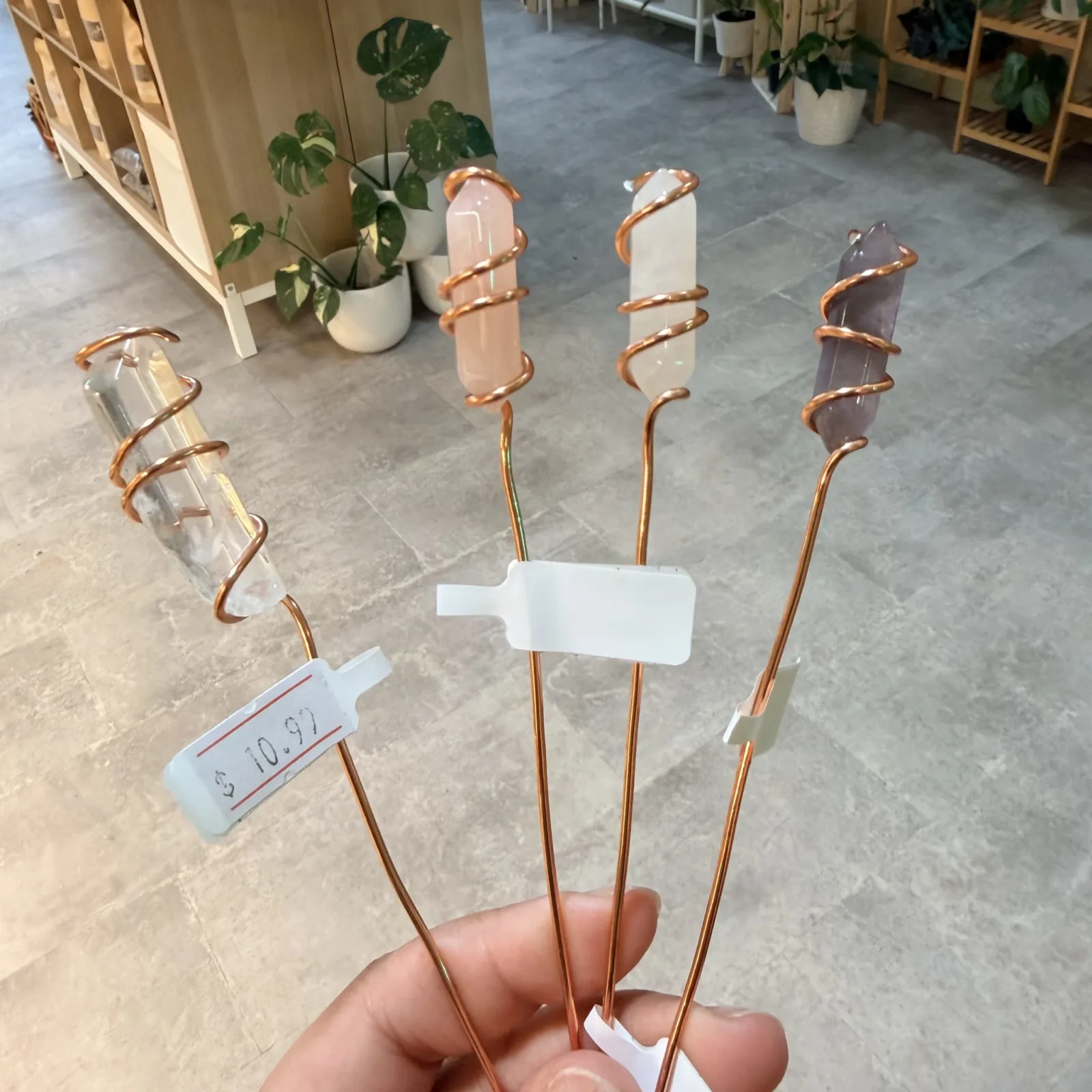 Plant Stake Faux Crystal with copper wire wrapping and clear quartz stones displayed indoors.