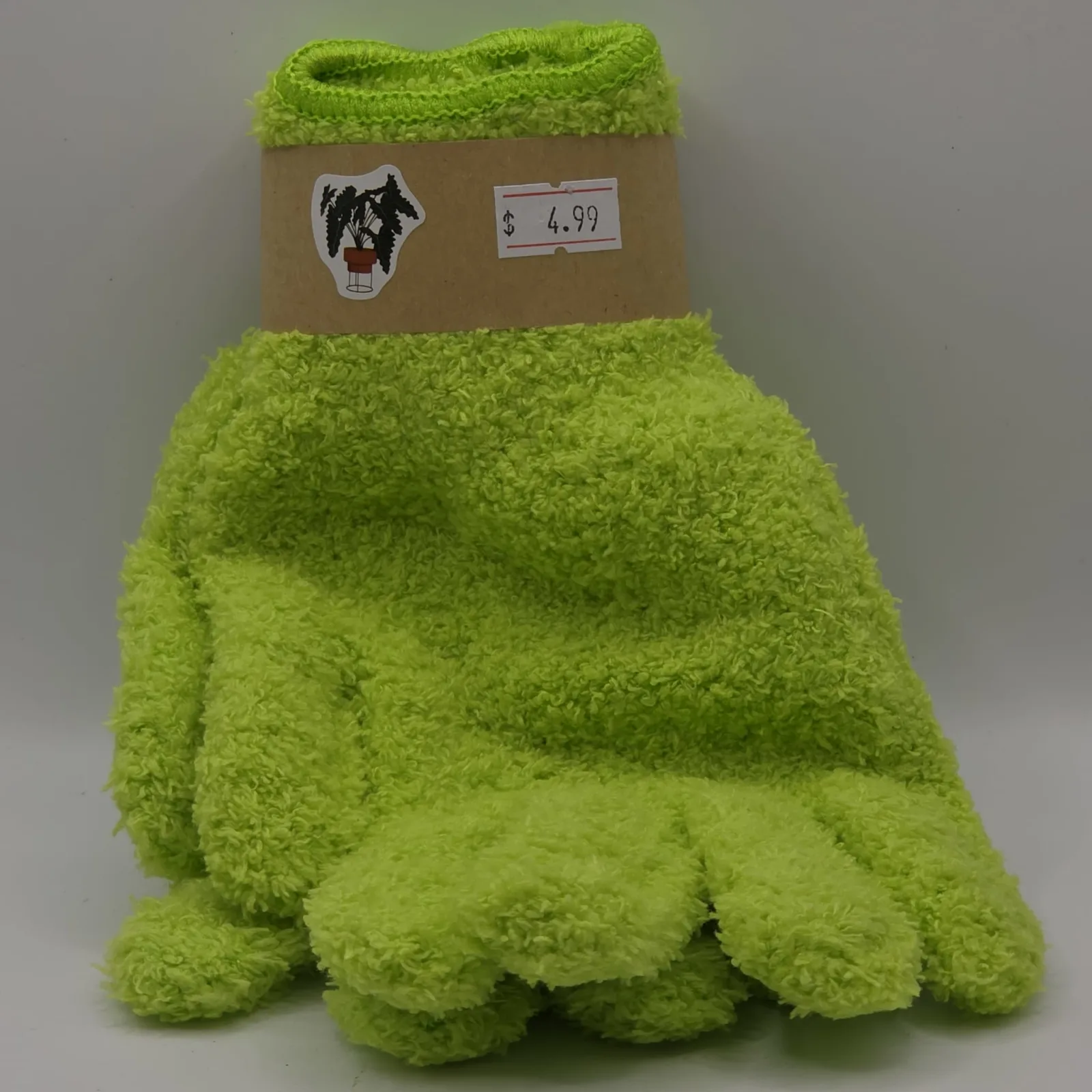 Bright green microfiber gloves with brown cardboard label and dog emblem, priced $4.99.