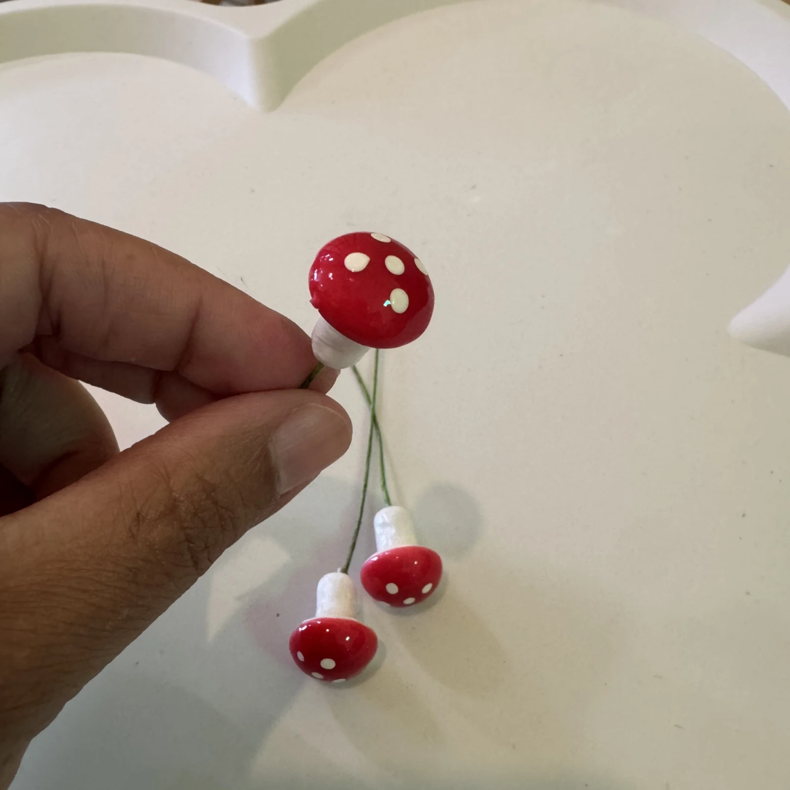 Mini Mushroom Plant Decor Stakes with red caps and white dots on stems.