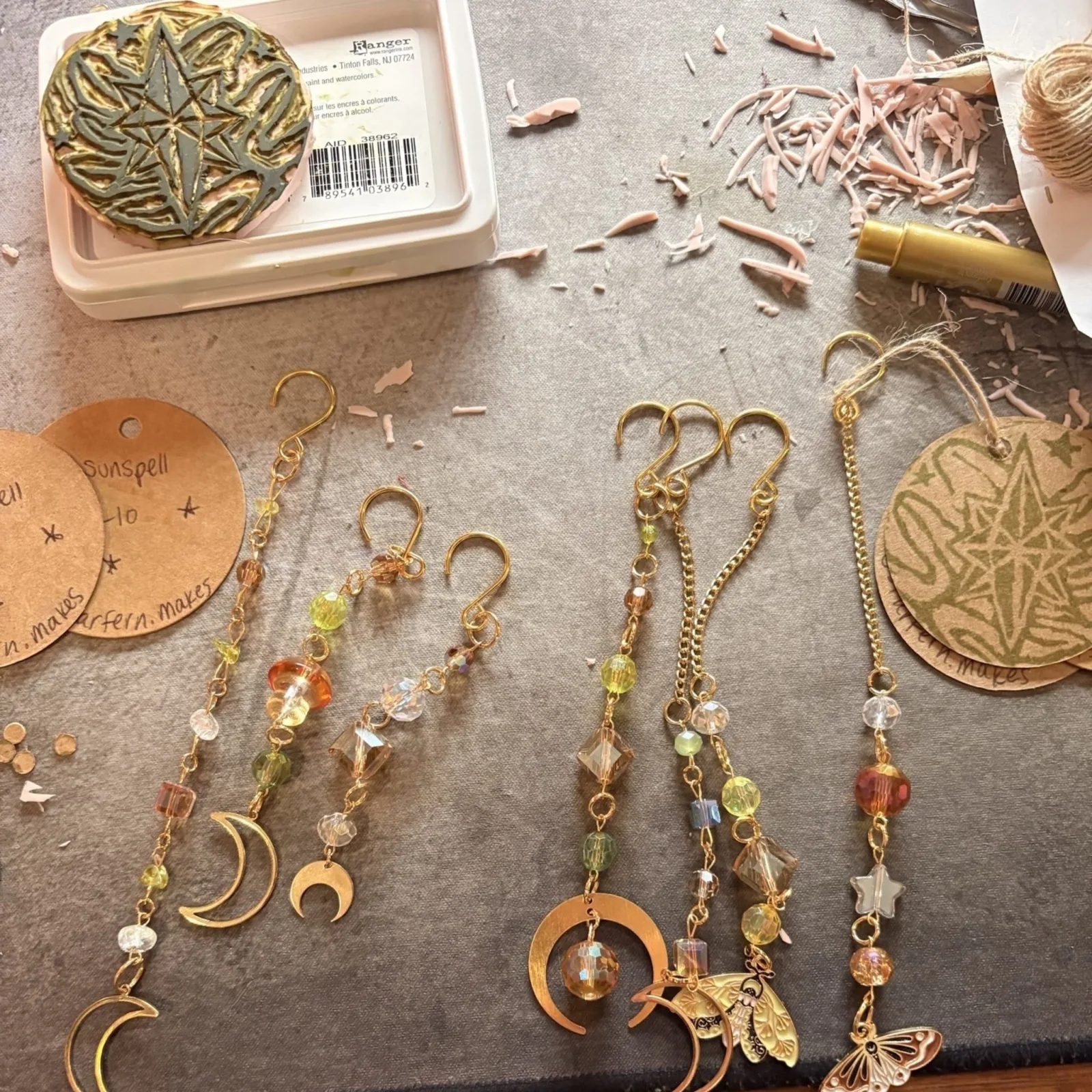 StarFern Plant Charms with decorative beaded keychain attachments displayed on crafting surface.