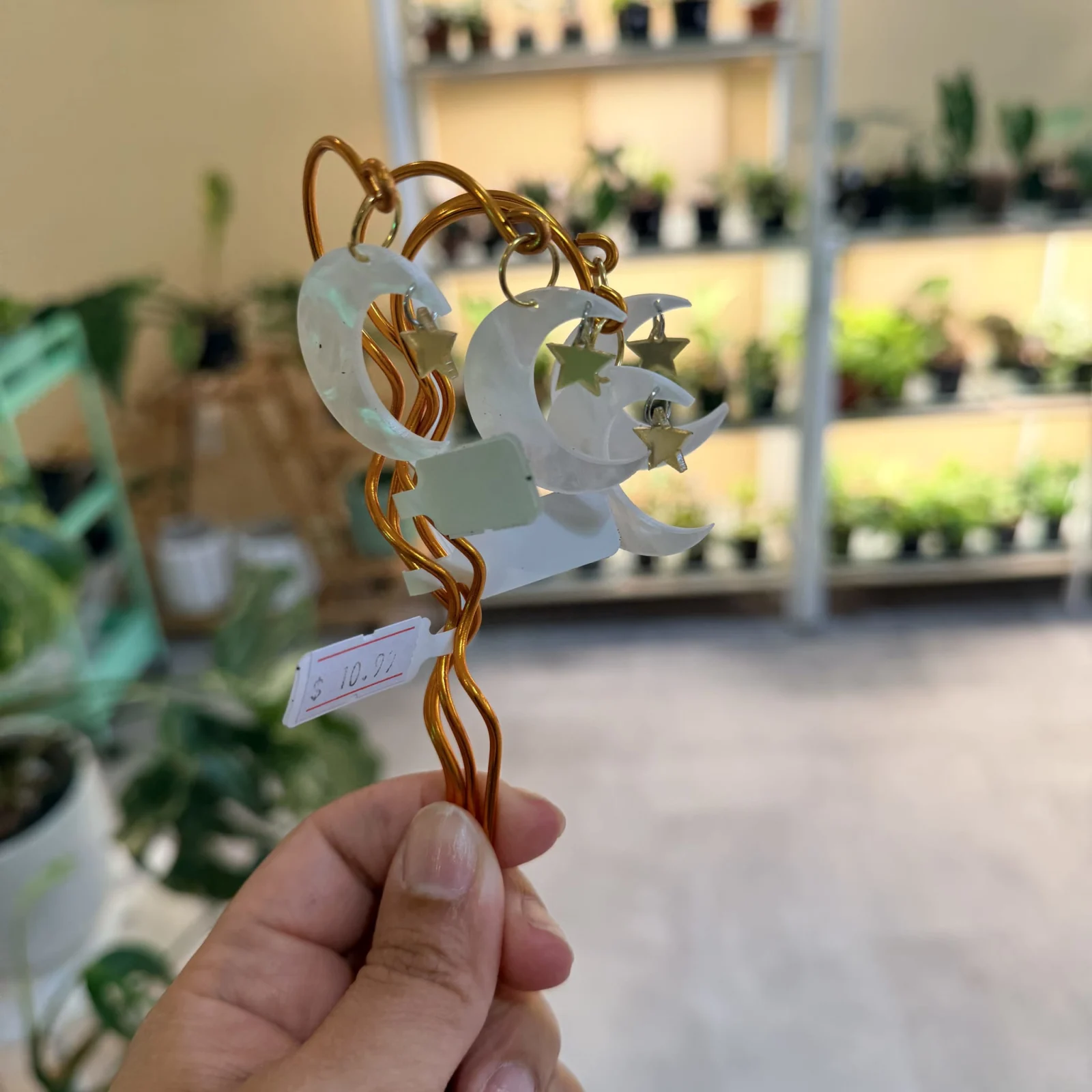 Plant Stake Moon and Star with white ceramic design and bronze twisted stem holder.