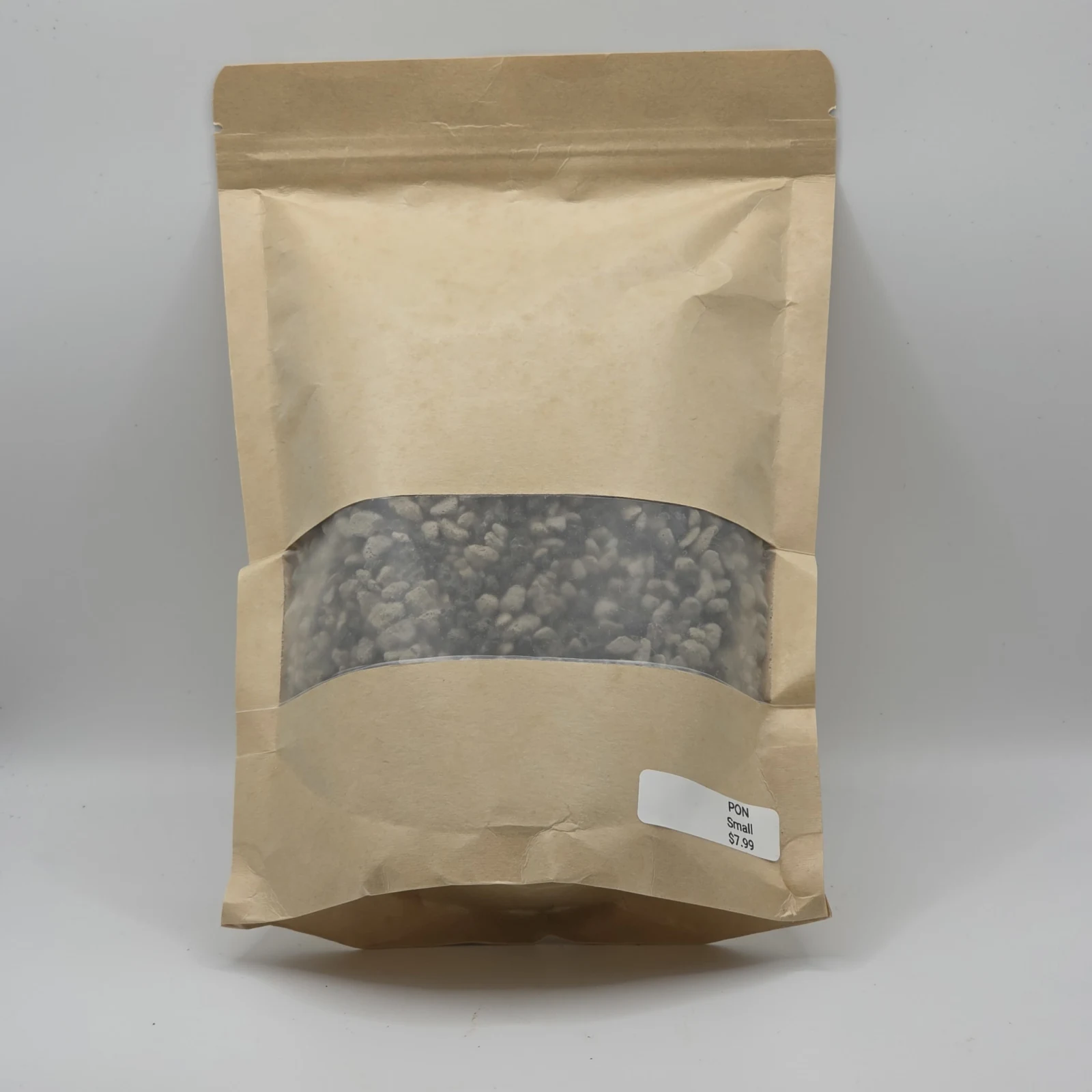 Pon lightweight horticultural substrate in kraft paper pouch with window display.