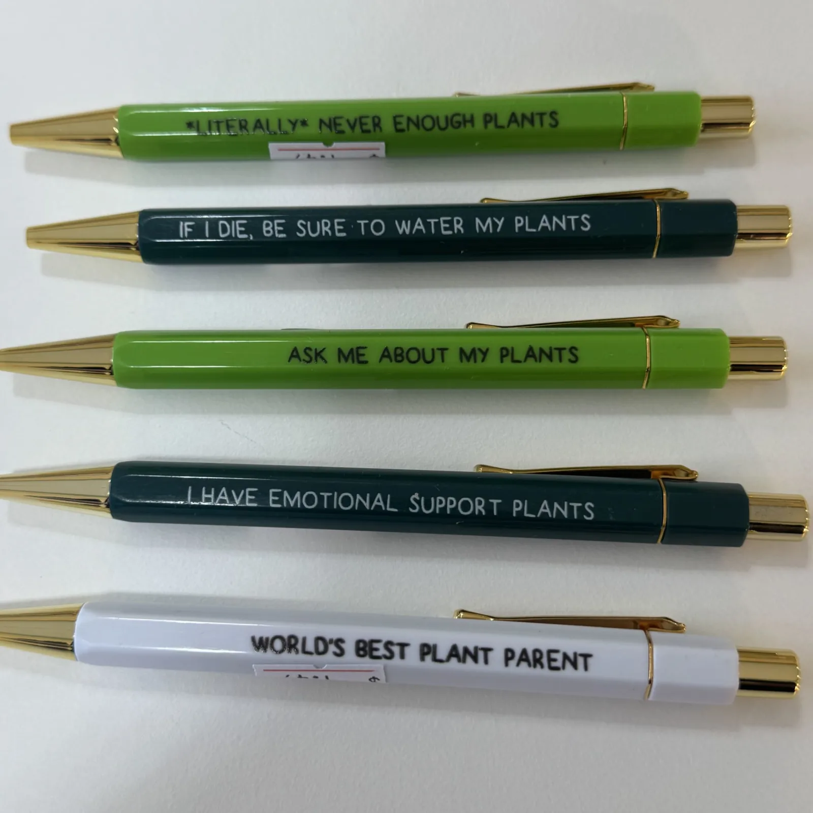 Plant Pen set with humorous plant-themed messages on green, black, and white pens.